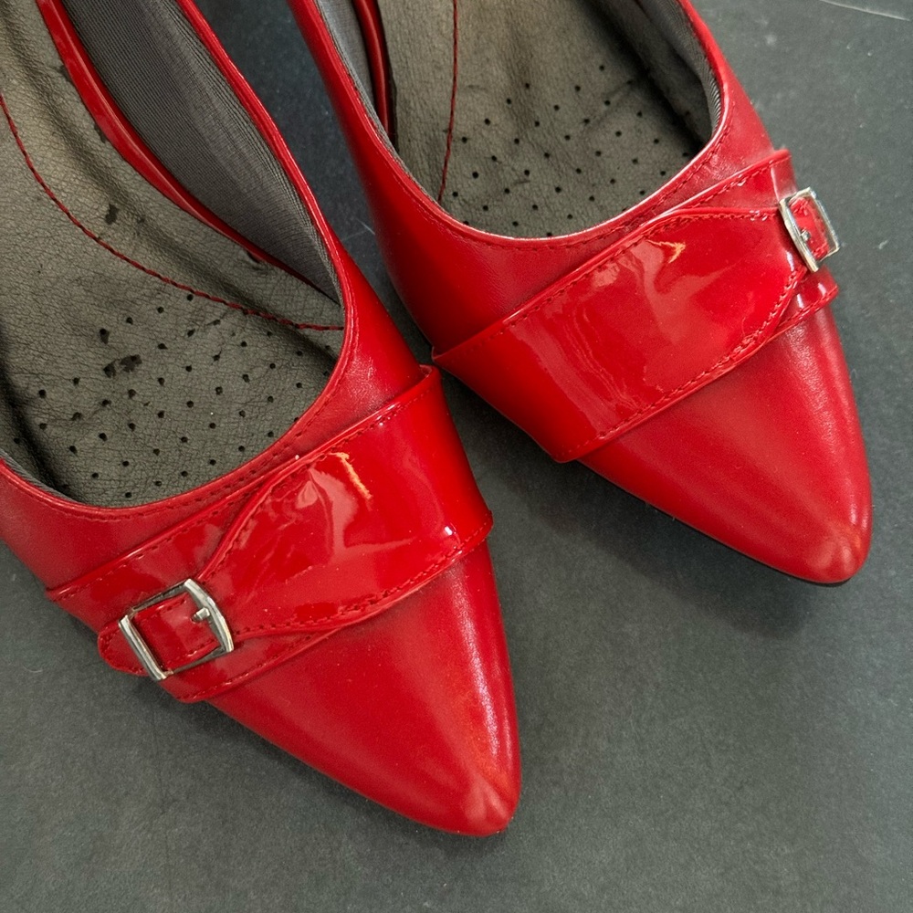 Red vegan leather pumps.